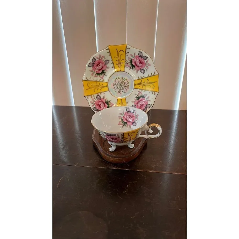 VINTAGE IRIDESCENT YELLOW TEA CUP AND SAUCER WITH ROSES